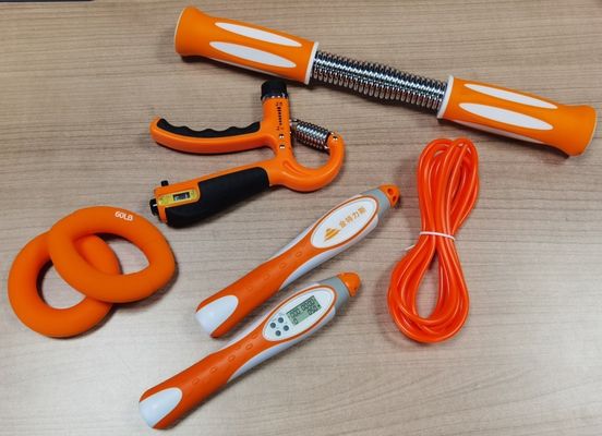 Un renforcement de cinq doigts, un manche, un exercice de force, un exercice portable en métal, un bracelet en silicone, un logo personnalisé